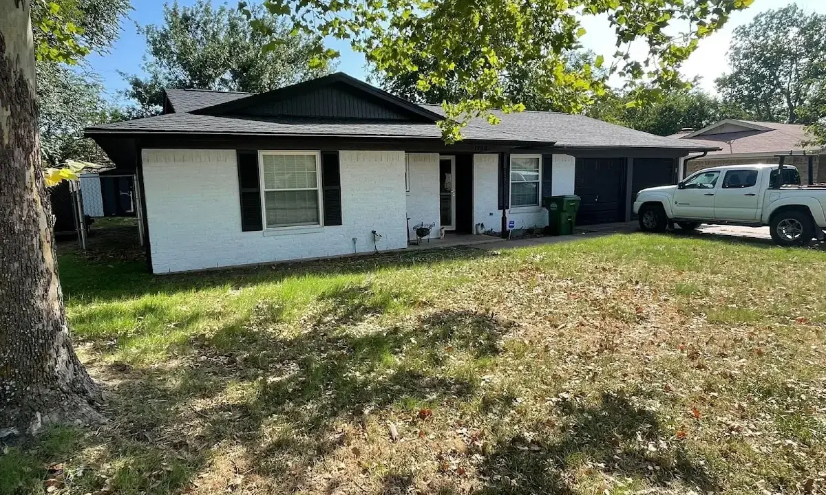 Professional roofing crew working on a residential roof in Stevensville
